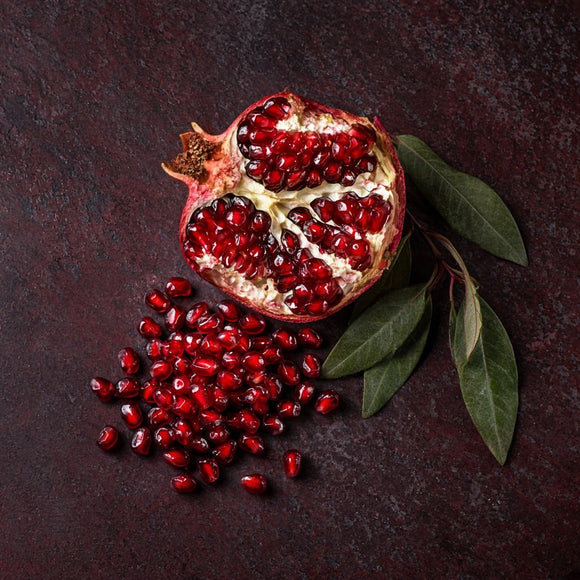 A ripe pomegranate split open, the source of Rubiora pomegranate extract